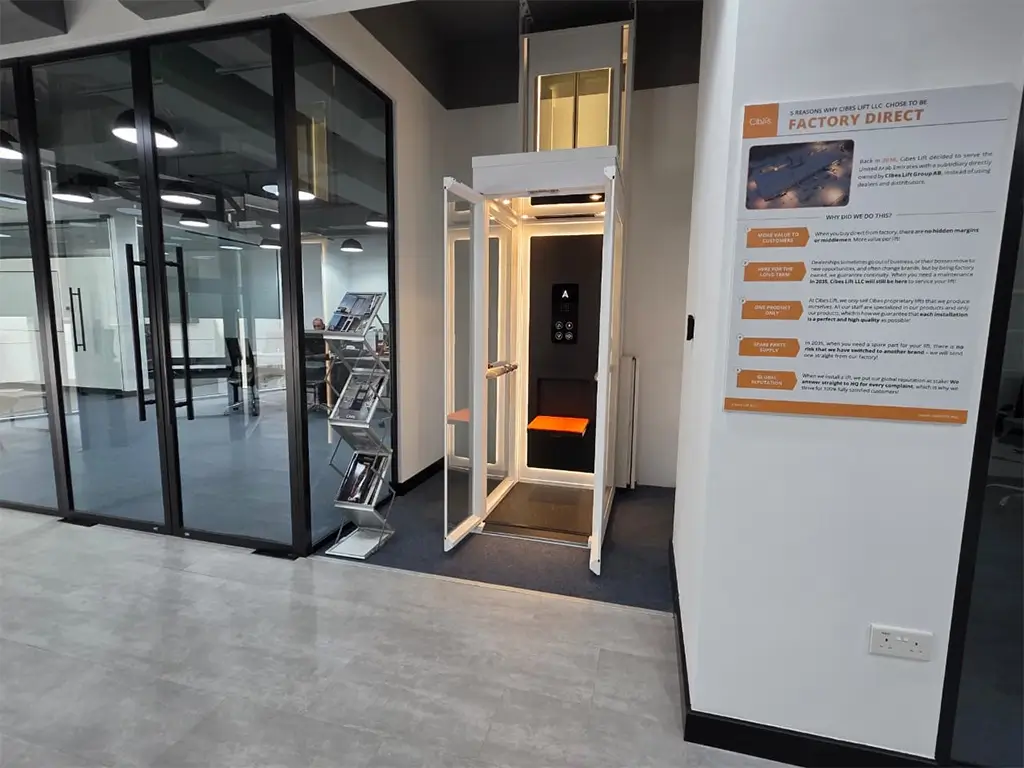 Ascenda demo lift on display at the Cibes Dubai Showroom, featuring glass panels and a modern minimalist cabin design.