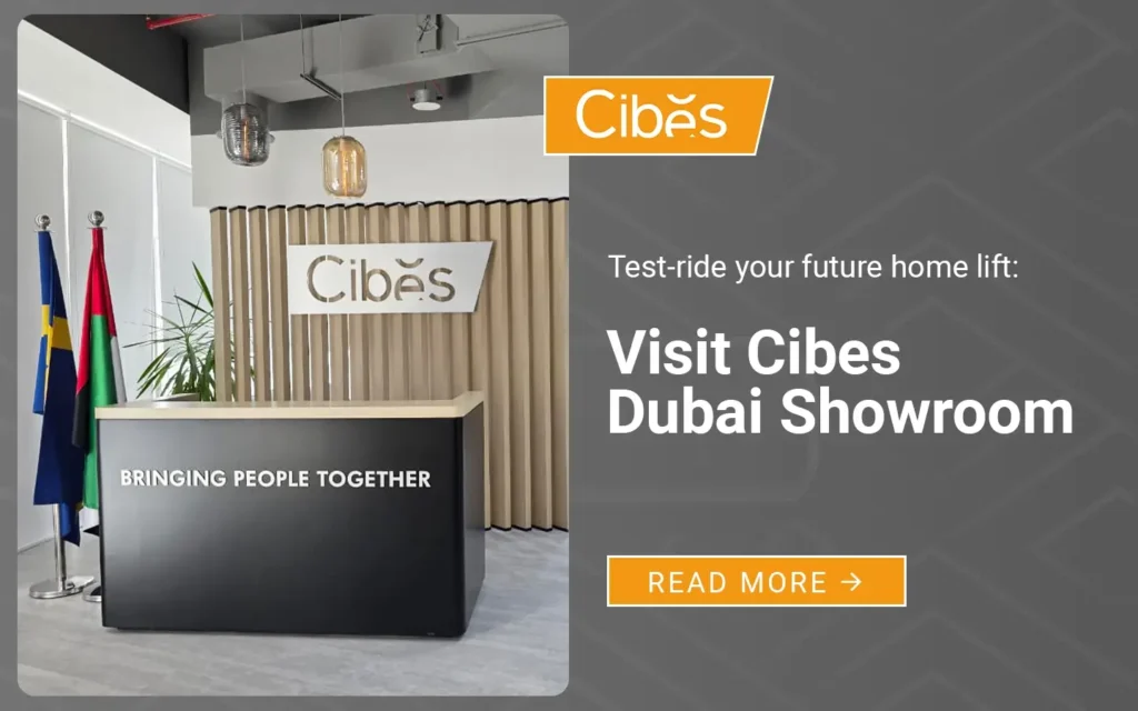 Cibes Dubai Showroom reception area with Cibes logo, Swedish and UAE flags, and signage promoting test-ride of home lifts.