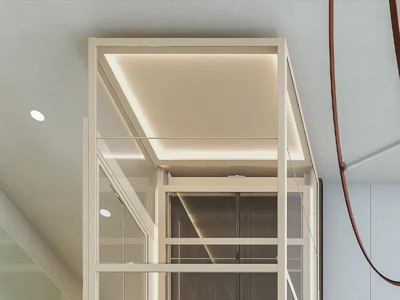 Recessed ceiling lighting detail inside the Cibes Air 2 platform lift, providing soft and even illumination for comfortable home lift use.
